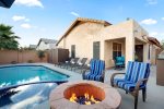 Private backyard with a heated pool, spa, fire pit, and BBQ